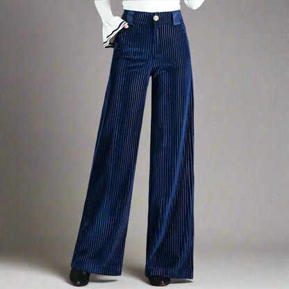 Pantalon en velours côtelé bleu marine à taille haute, idéal pour un style élégant.